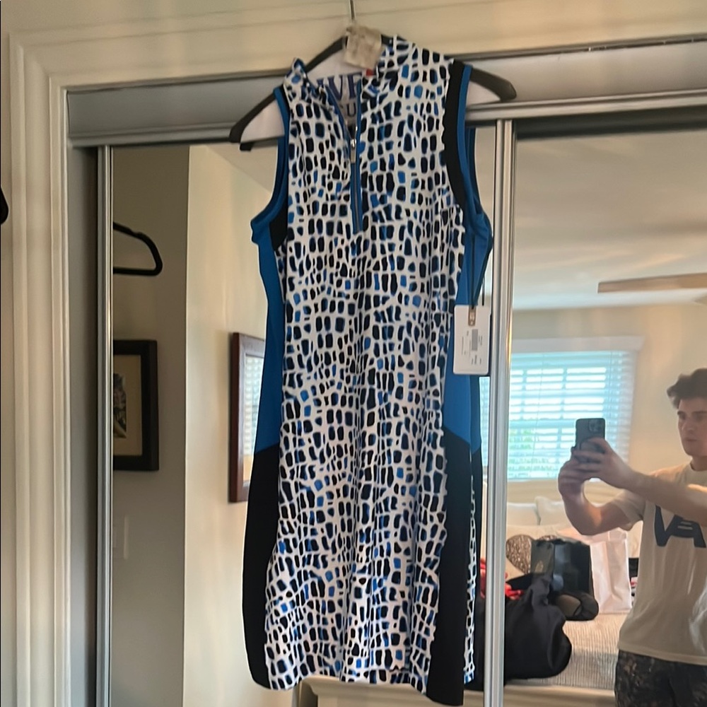 Tail sleeveless animal print golf dress with 1/4 zip